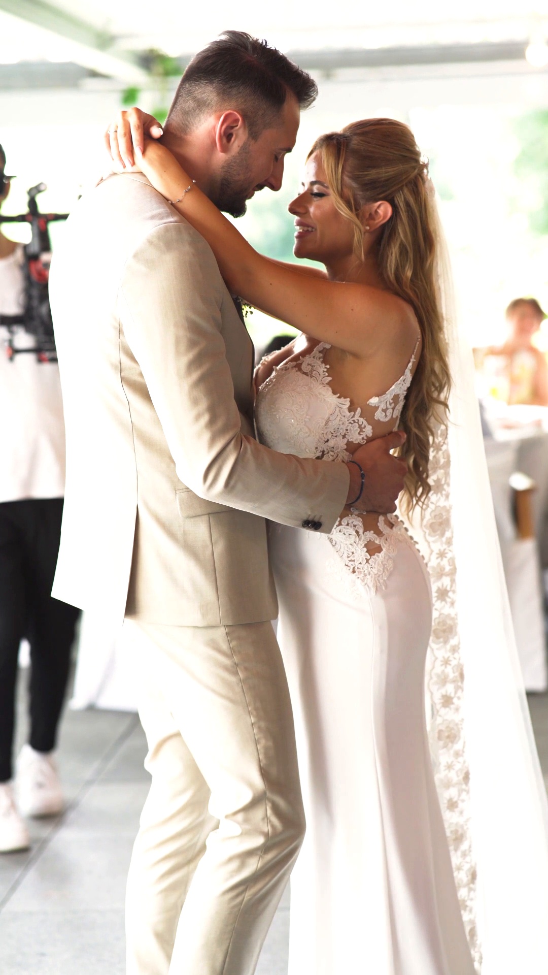 A bride and groom holding each other during their first dance
